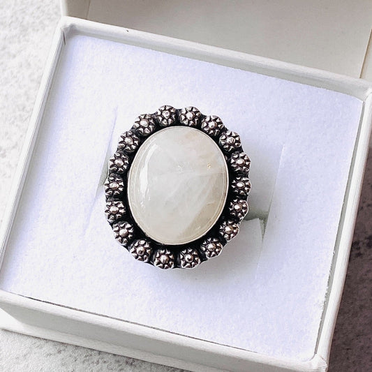 Handcrafted moonstone statement ring featuring a large 17 x 20 mm natural gemstone set in sterling silver. This one of a kind size 9 ring is designed for women who love bold artisan jewelry and substantial stone rings.