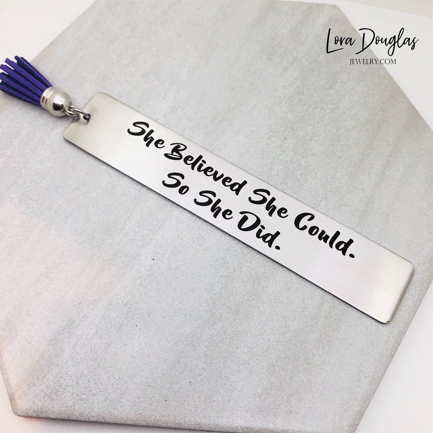 Inspirational engraved bookmark featuring "She Believed She Could So She Did" on brushed stainless steel with optional personalized back engraving. Thoughtful graduation gift, new job gift, retirement gift, or encouragement gift.