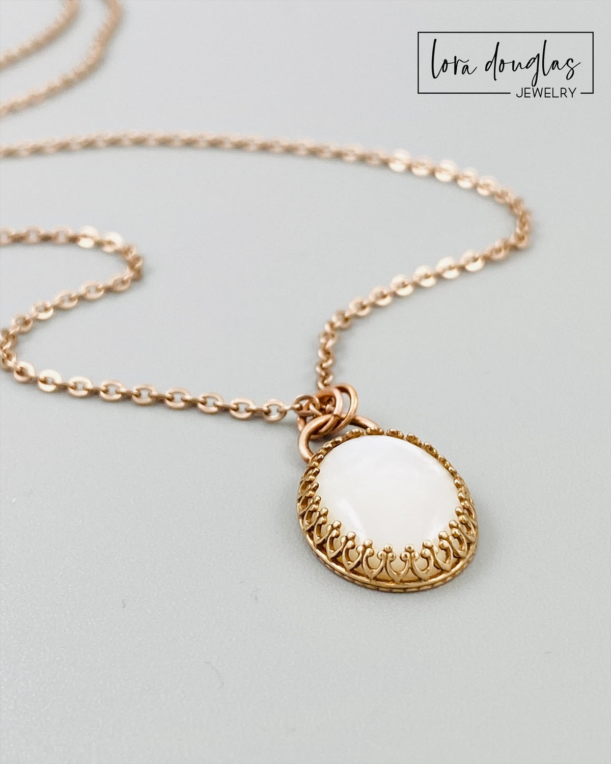 Moonstone pendant necklace combining a natural gemstone with a bronze setting and durable stainless steel chain. This 18 inch mixed metal necklace is a distinctive choice for lovers of artisan and natural stone jewelry.