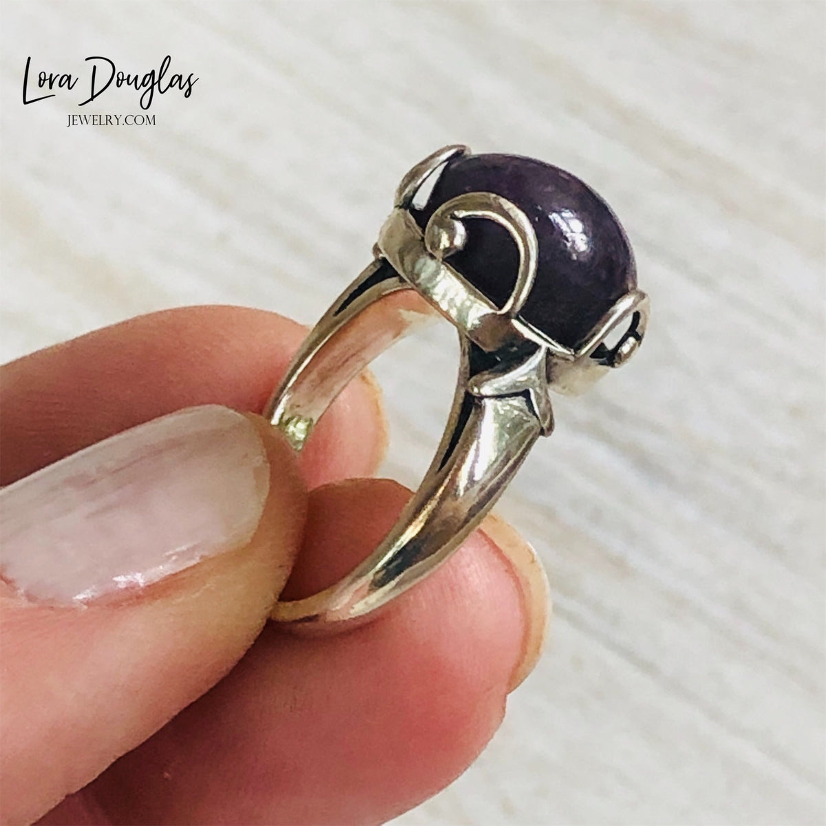 Natural Purple India Ruby and sterling silver ring featuring a richly colored 12mm gemstone with an 8mm height, creating a distinctive size 7 statement ring for lovers of purple gemstone jewelry.
