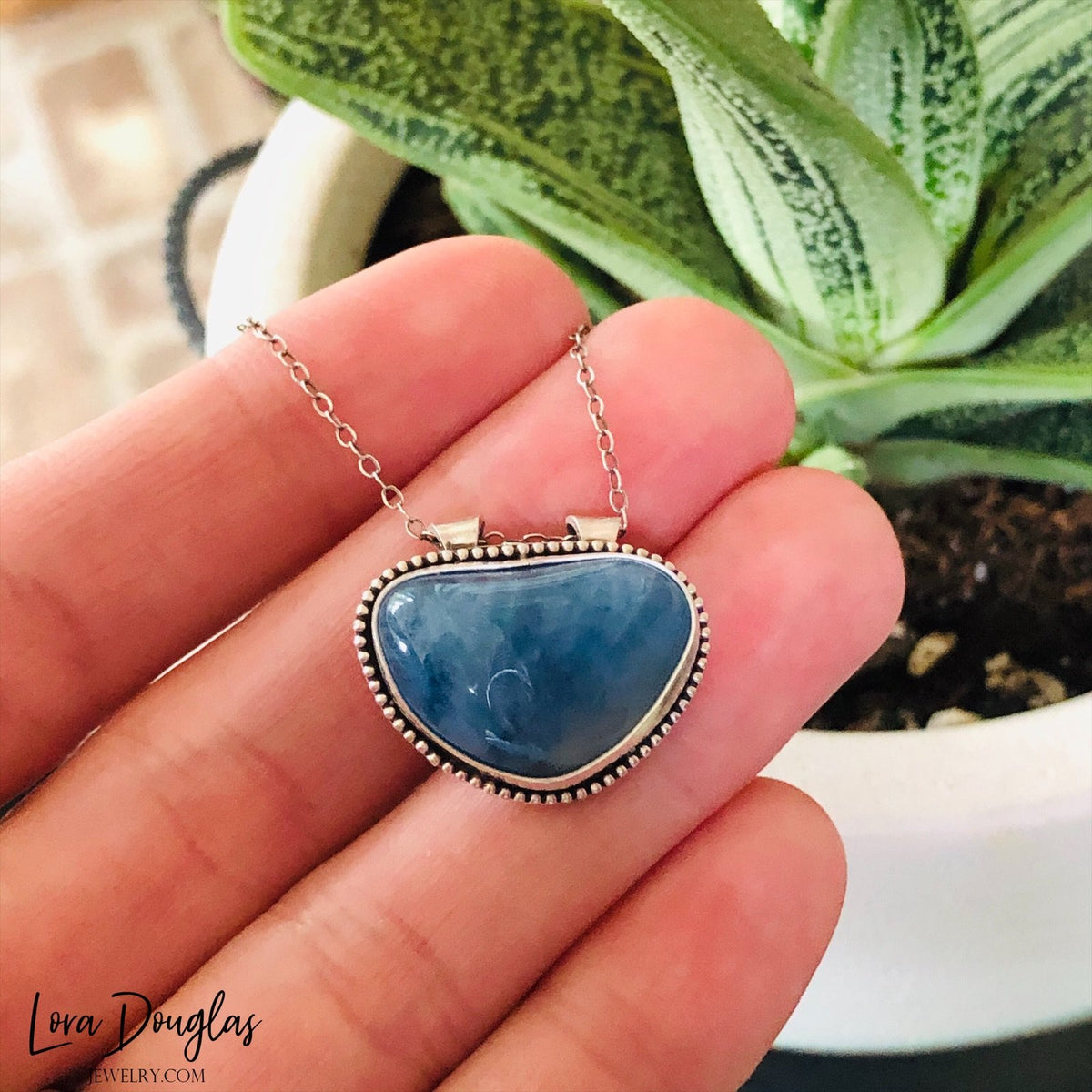 Natural blue gemstone necklace featuring aquamarine in a substantial sterling silver pendant, with a 20mm x 23mm setting and 18 inch antique patina chain for shoppers seeking distinctive stone jewelry.
