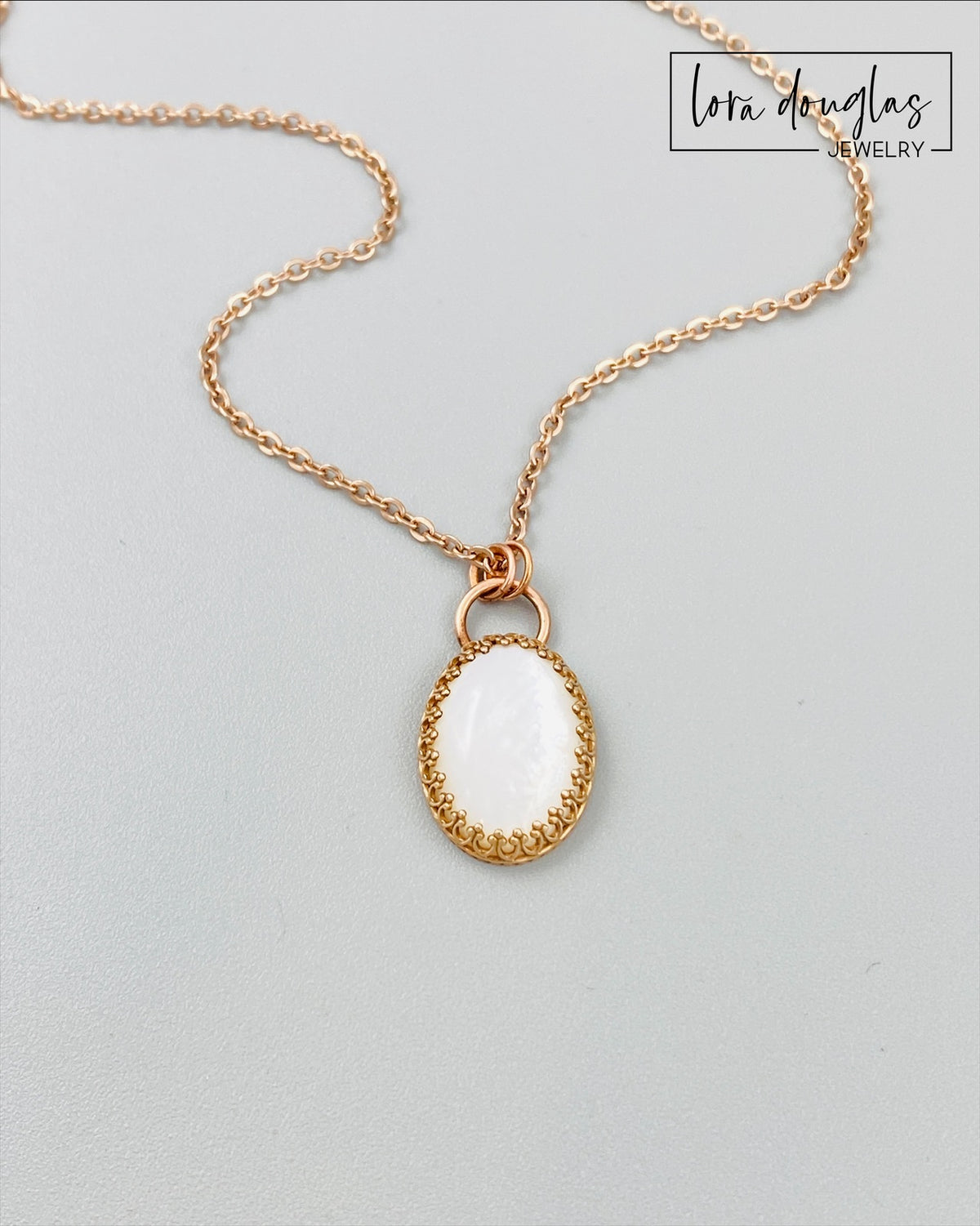 Natural gemstone necklace with a moonstone pendant in a warm bronze setting and an 18 inch stainless steel chain. The neutral stone and mixed metal combination make this an easy everyday necklace or gift for her.