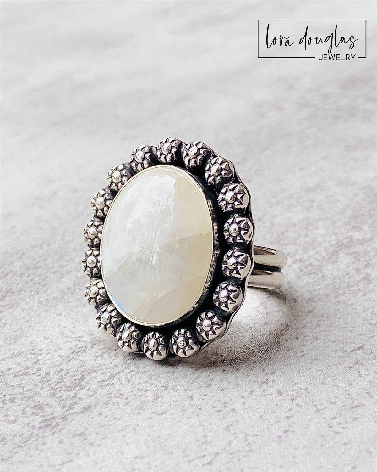 Natural gemstone statement ring featuring moonstone in a handcrafted sterling silver setting measuring approximately 24 x 28 mm. The finished size 9 ring is designed for women who prefer bold, substantial silver jewelry.