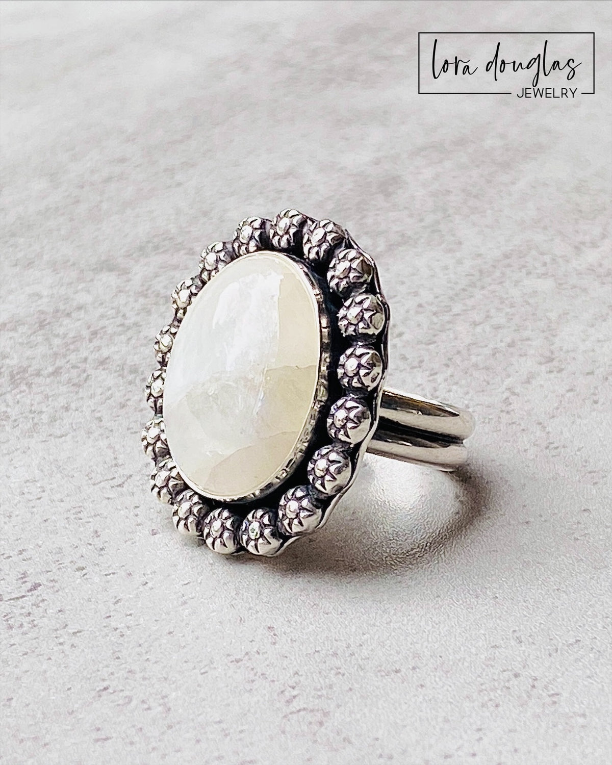 Natural moonstone ring handcrafted in sterling silver with a substantial 24 x 28 mm setting. The large gemstone makes this size 9 statement ring a distinctive choice for collectors of artisan silver jewelry.