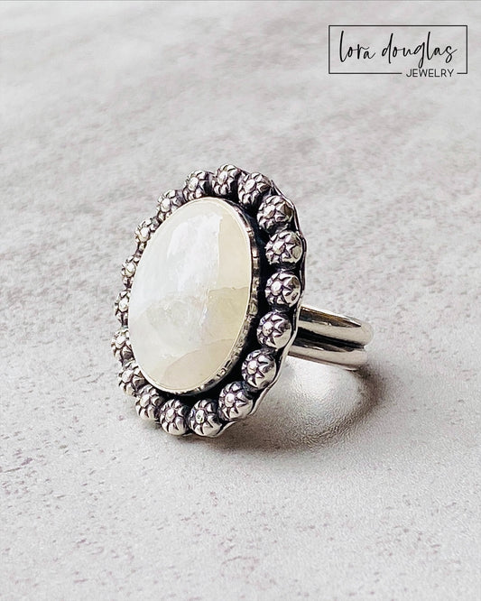 Natural moonstone ring handcrafted in sterling silver with a substantial 24 x 28 mm setting. The large gemstone makes this size 9 statement ring a distinctive choice for collectors of artisan silver jewelry.