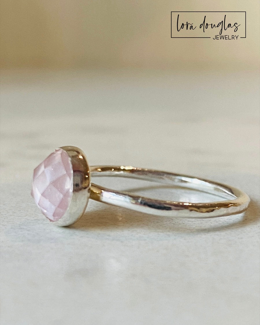 Natural pink gemstone ring featuring rose quartz in an 8mm rose cut with a faceted surface, set in sterling silver as a finished size 7.5 solitaire ring for shoppers looking for understated gemstone jewelry.
