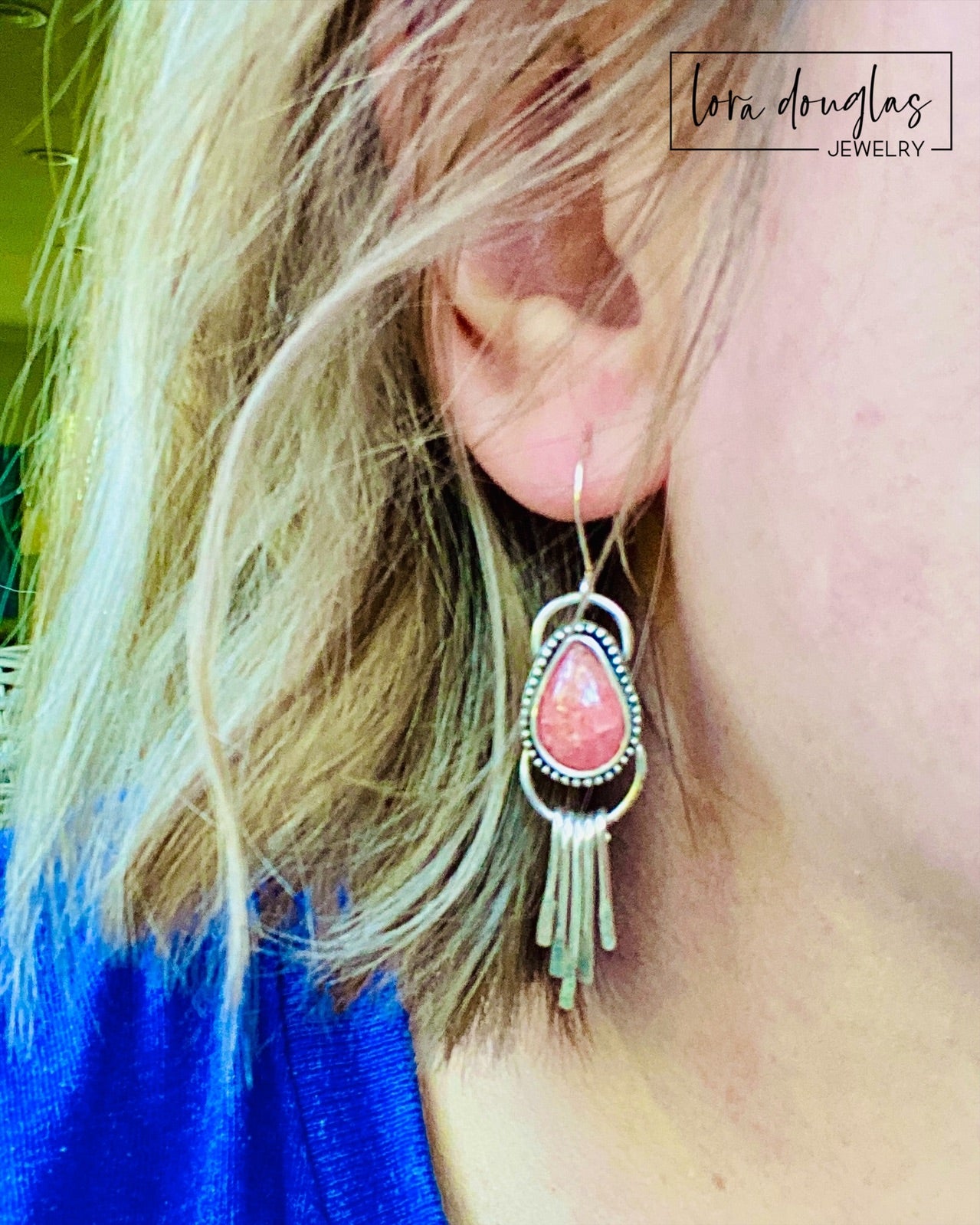 Natural rhodochrosite earrings featuring pink teardrop gemstones paired with dangling sterling silver fringe and silver ear wires, creating lightweight handcrafted earrings measuring approximately 2 inches long.
