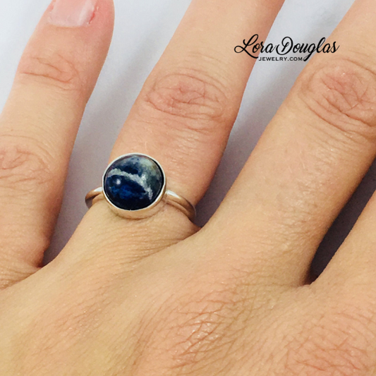 Natural sodalite ring featuring a 10mm blue gemstone set in genuine 925 sterling silver, shown as a finished US size 6 ring for shoppers looking for distinctive blue gemstone and natural stone jewelry.
