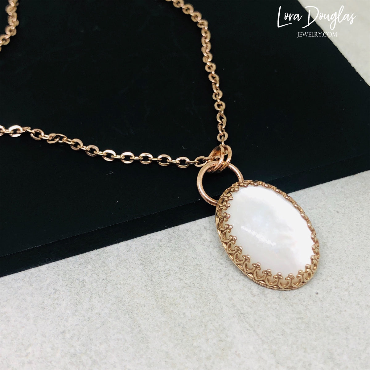 Natural stone pendant necklace showcasing moonstone in a bronze setting with an 18 inch stainless steel chain. A distinctive gemstone gift for women who enjoy boho jewelry, artisan designs, and mixed metal accessories.