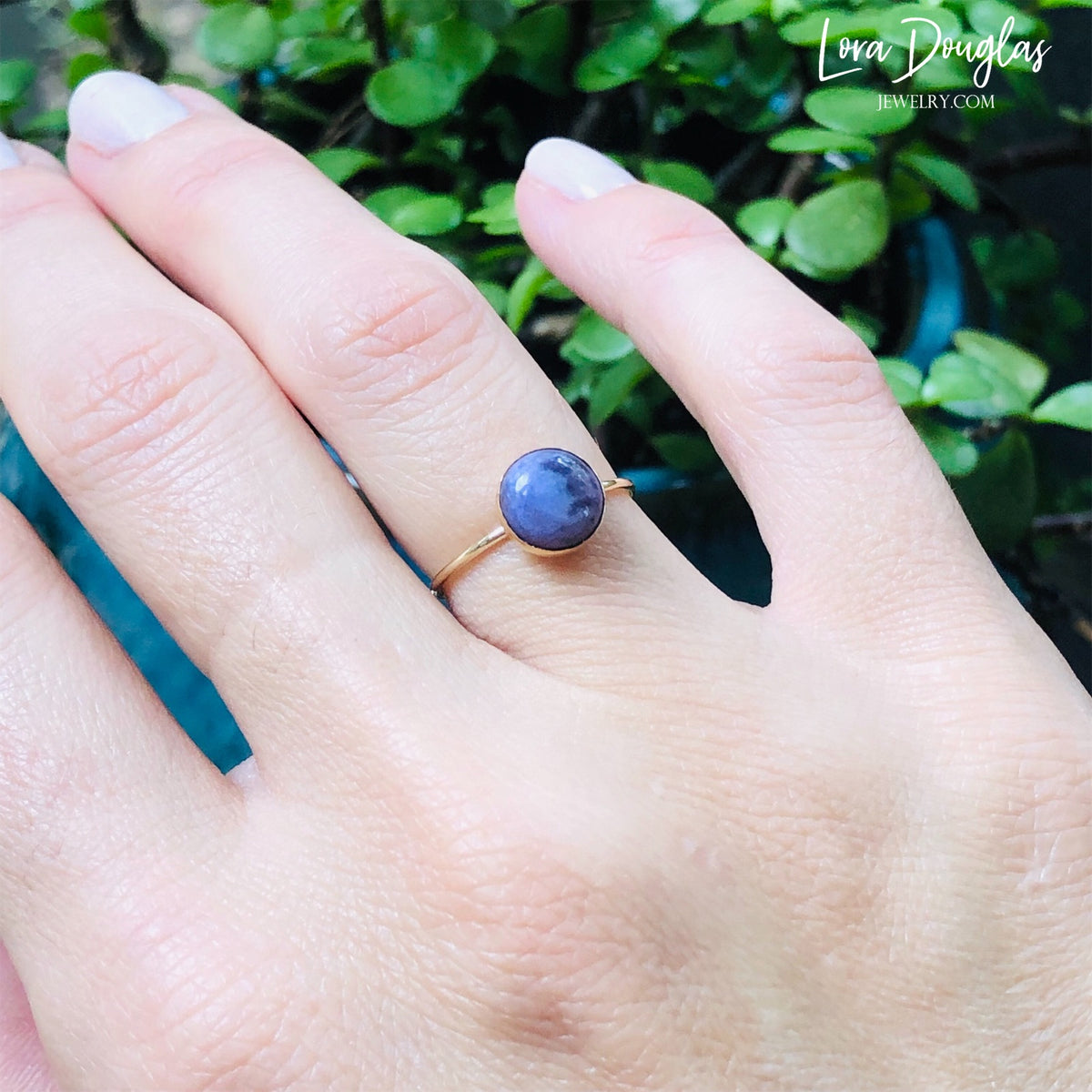 Natural stone ring featuring an 8mm purple charoite gemstone set in warm gold filled metal, highlighting the color and natural character of this finished US size 6 ring for purple gemstone jewelry lovers.
