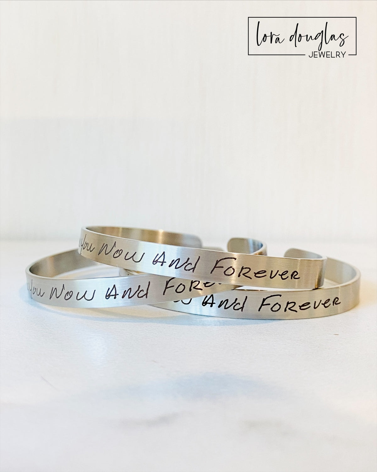 Personalized bride bracelet featuring actual handwriting permanently laser engraved on stainless steel. Elegant wedding jewelry created from handwritten vows, engagement letters, or meaningful messages exchanged between couples.