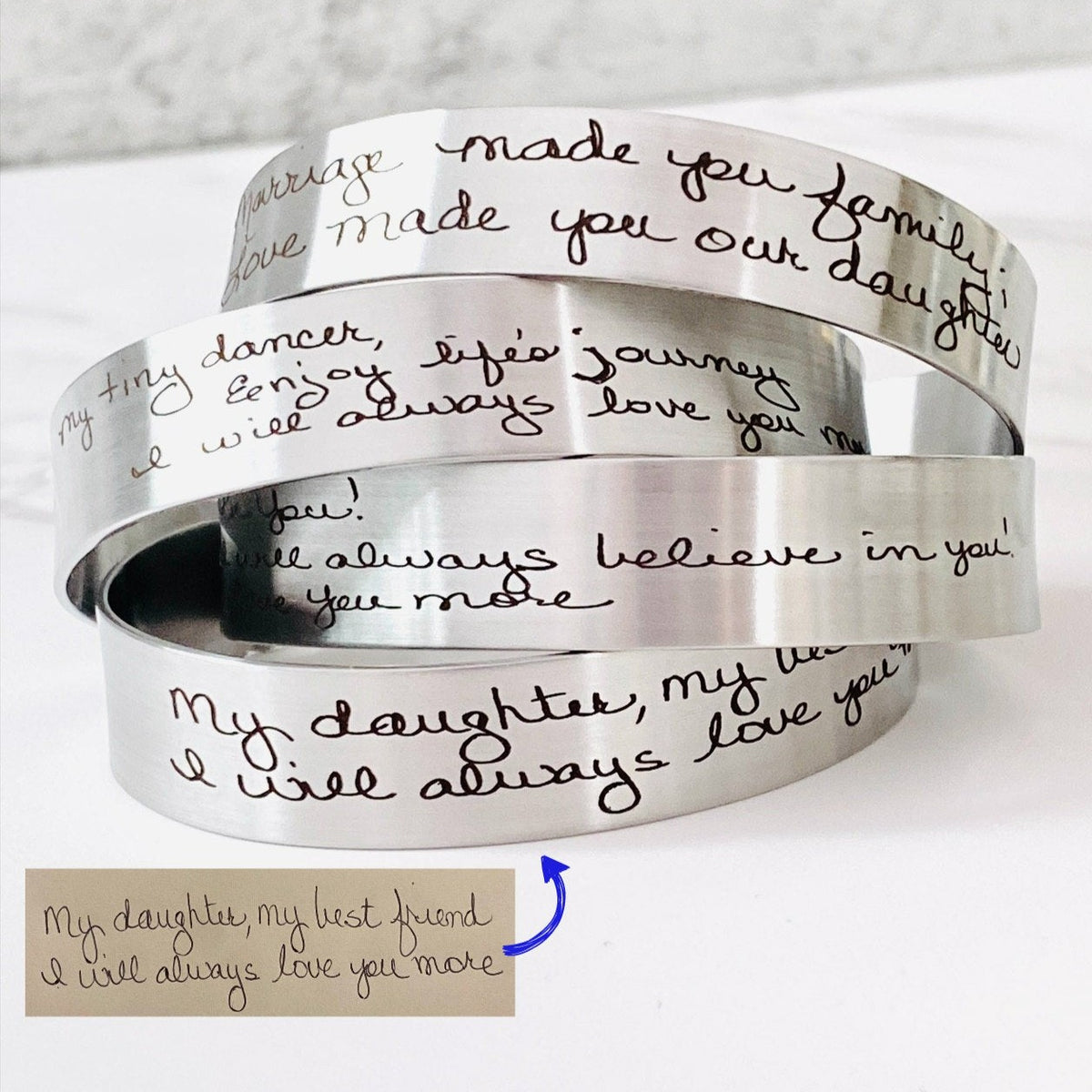 Personalized handwriting bracelet engraved with the actual handwriting of a loved one on a stainless steel cuff. Custom memorial jewelry available in silver, gold, or rose gold, creating a meaningful keepsake for everyday wear.