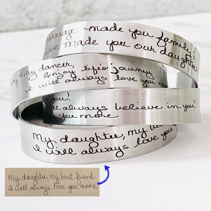 Personalized handwriting bracelet engraved with the actual handwriting of a loved one on a stainless steel cuff. Custom memorial jewelry available in silver, gold, or rose gold, creating a meaningful keepsake for everyday wear.