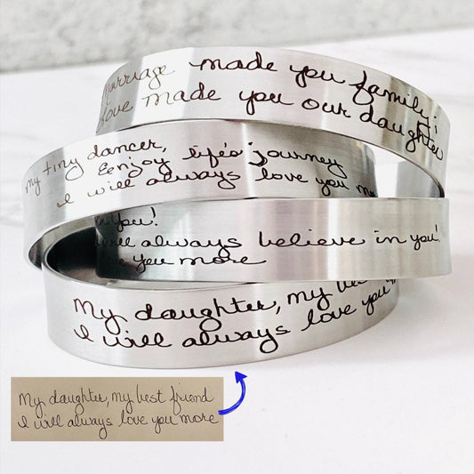 Personalized handwriting bracelet engraved with the actual handwriting of a loved one on a stainless steel cuff. Custom memorial jewelry available in silver, gold, or rose gold, creating a meaningful keepsake for everyday wear.