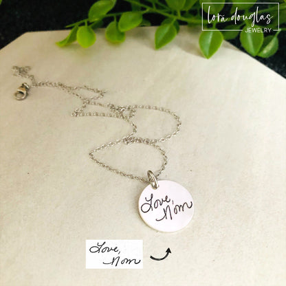 Personalized handwriting bracelet featuring a custom engraved round charm attached to a stainless steel bangle. Memorial jewelry created from real handwriting and handcrafted for meaningful everyday wear.