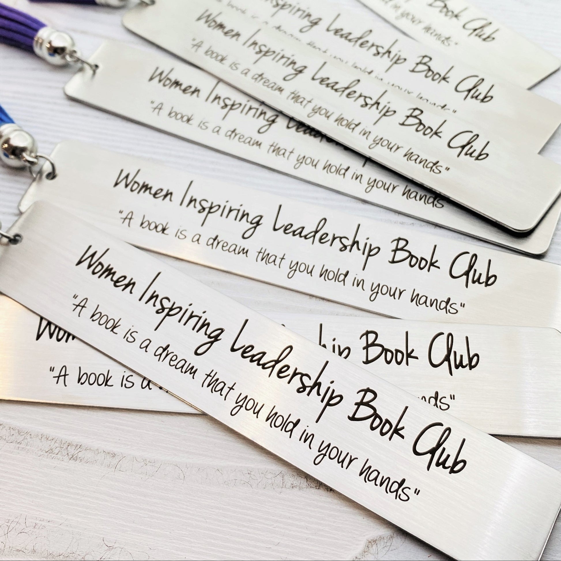Personalized metal bookmark made from stainless steel and engraved with your custom quote, club name, or special message. Unique keepsake gift for book lovers, book clubs, graduation gifts, literary events, and reader appreciation.