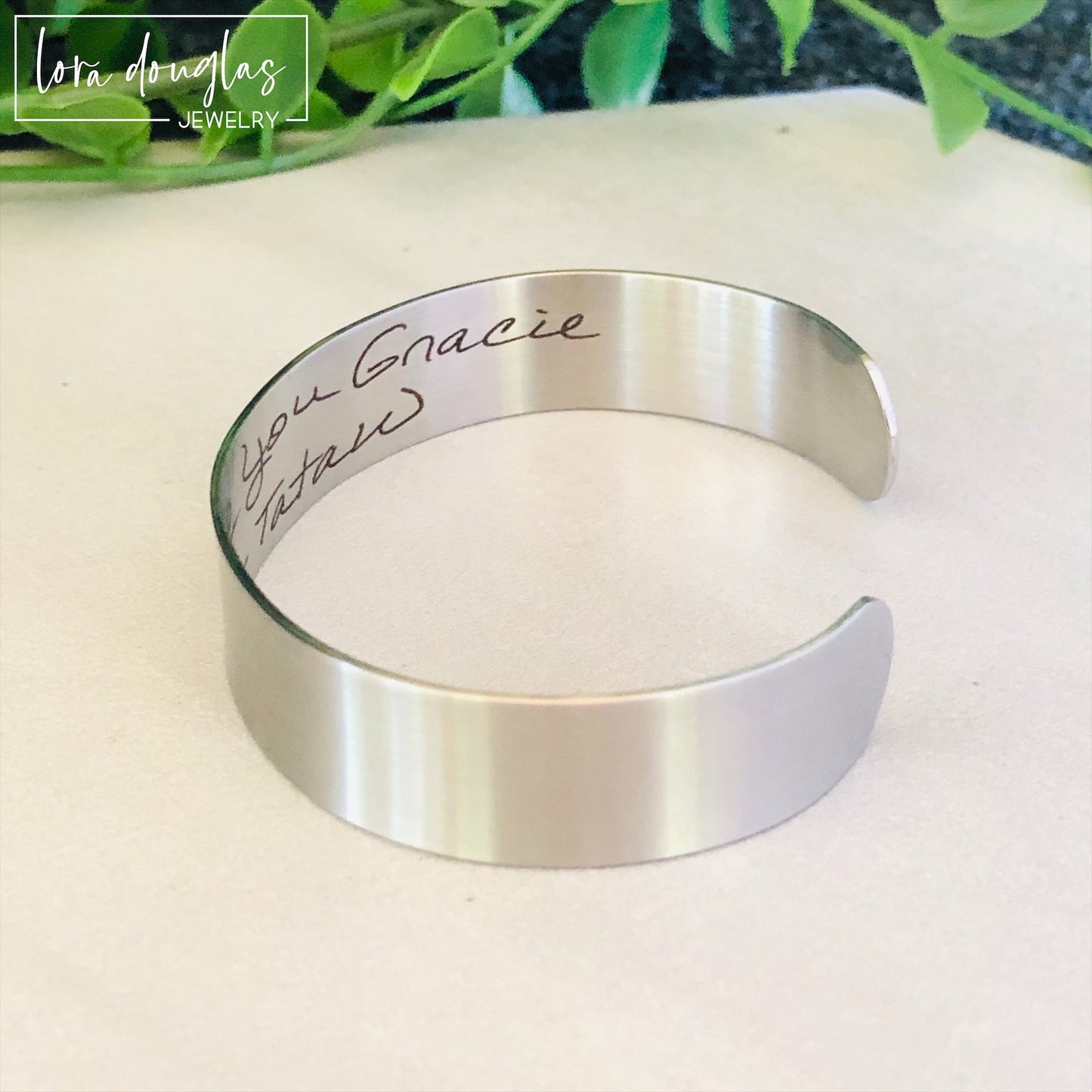 cuff bracelet with handwritten message engraved on the inside