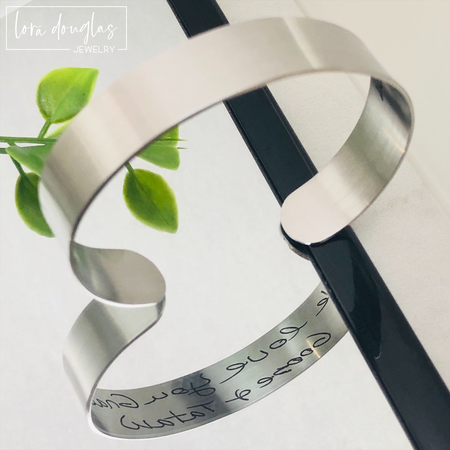 cuff bracelet with handwritten message engraved on the inside