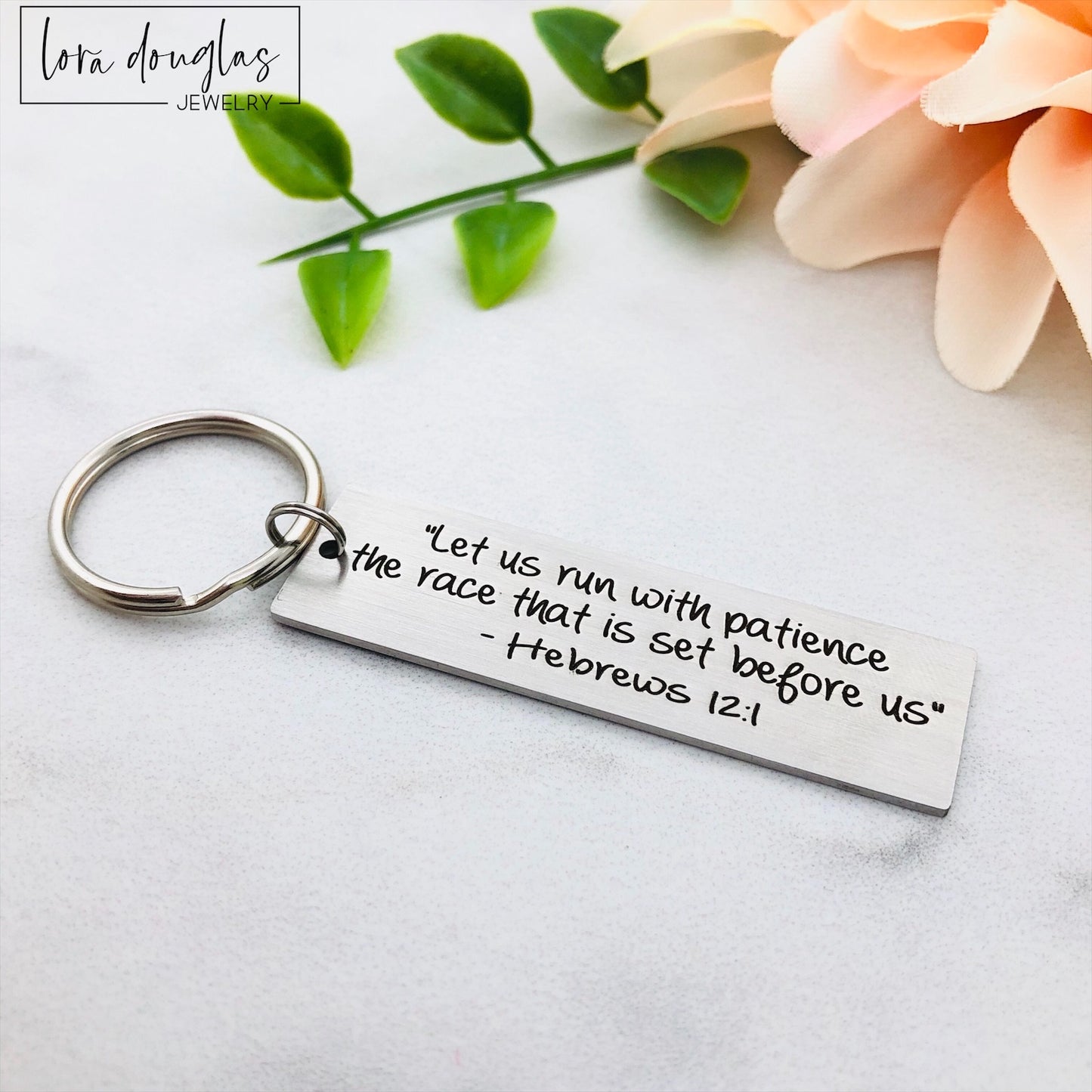 silver metal keychain with custom Bible verse engraved