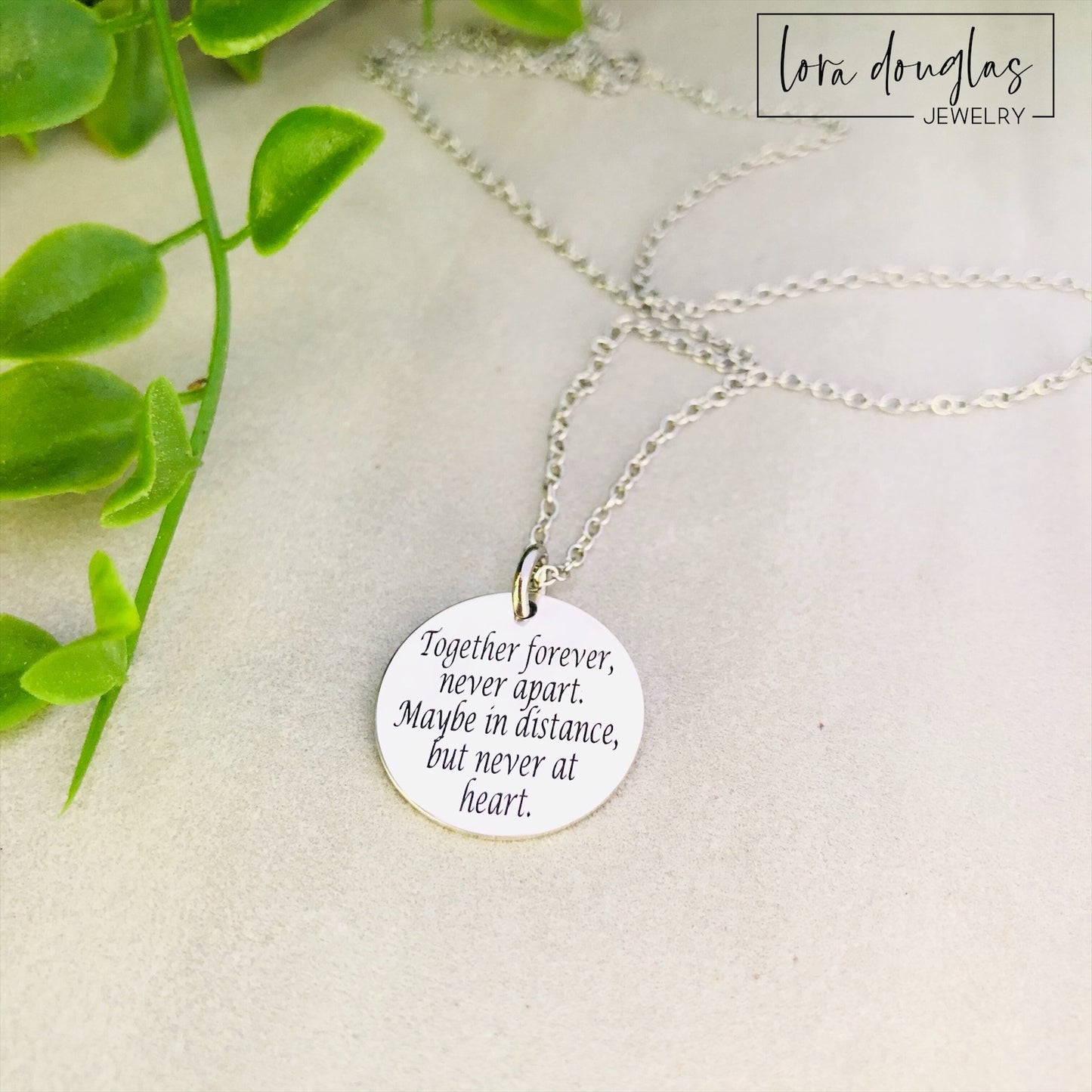 Silver necklace engraved with Together Forever Never Apart Maybe in Distance But Never at Heart