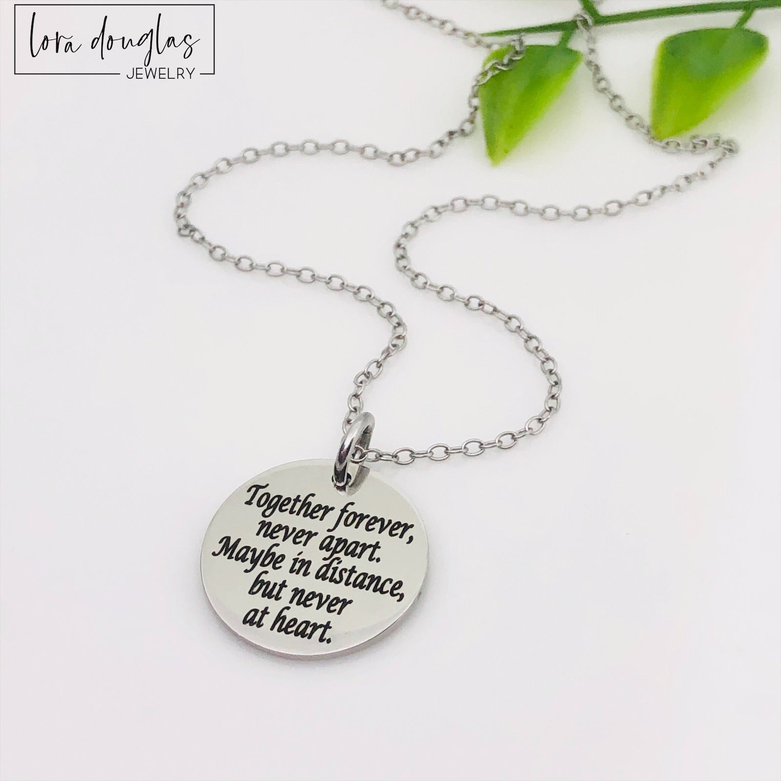 Silver necklace engraved with Together Forever Never Apart Maybe in Distance But Never at Heart