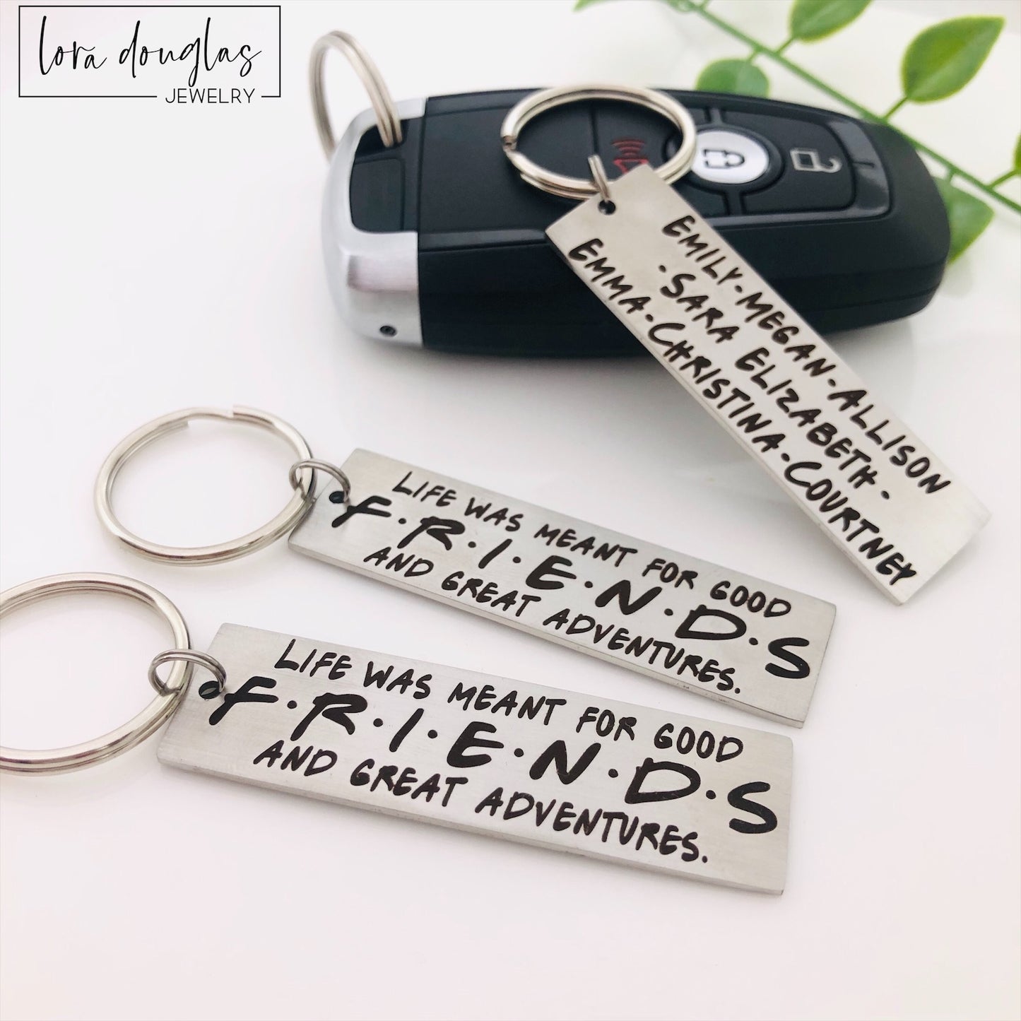 stainless steel keychains with engraved text 'Life was meant for good FRIENDS and great Adventures' 