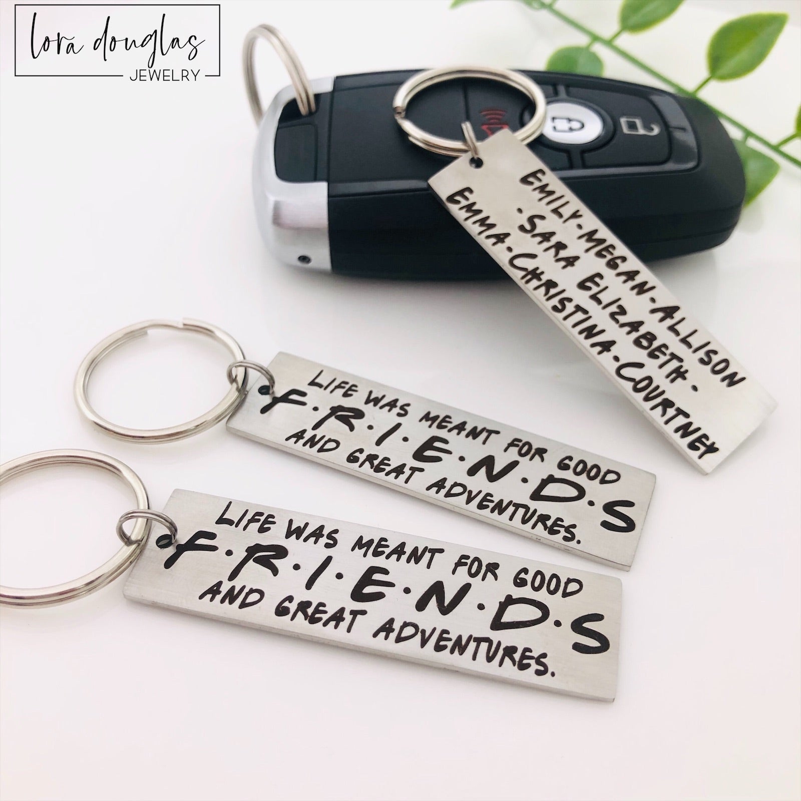 stainless steel keychains with engraved text 'Life was meant for good FRIENDS and great Adventures' 