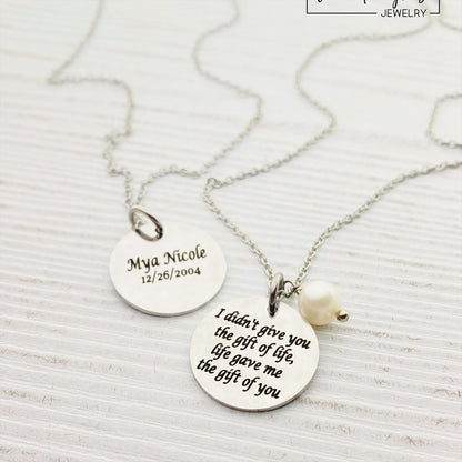 Two silver pendants with engraved with 'I DIDN'T GIVE YOU THE GIFT OF LIFE, LIFE GAVE ME THE GIFT OF YOU' 