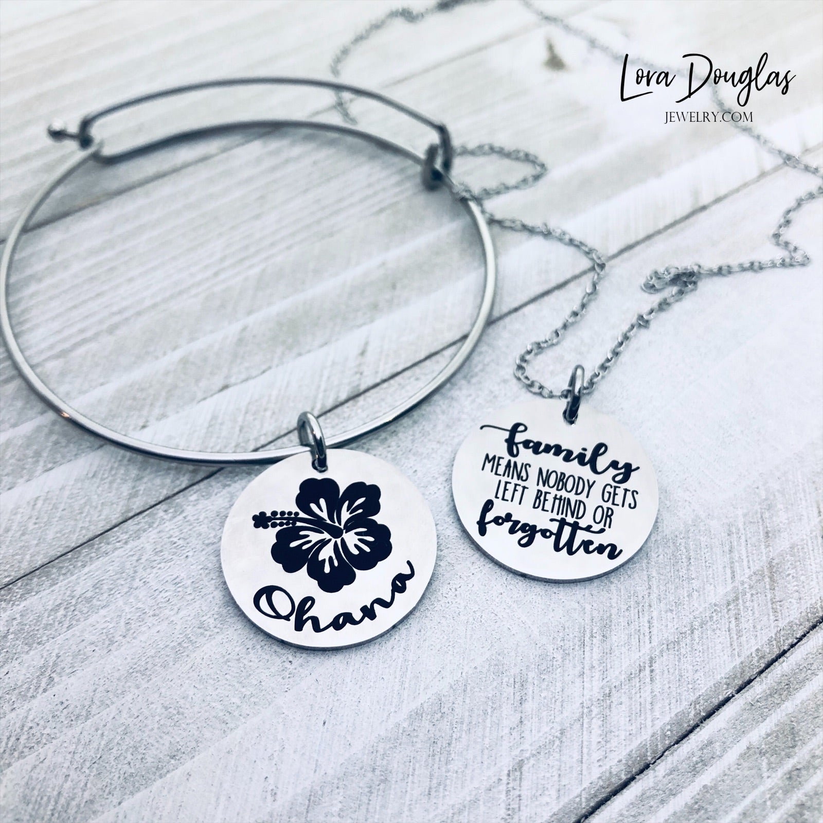 A collection of jewelry items with Ohana, Family means no one gets left behind or forgotten. available in bracelet, necklace or charm options