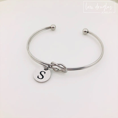 silver stainless steel knot bracelet with initial charm. bridesmaid gift