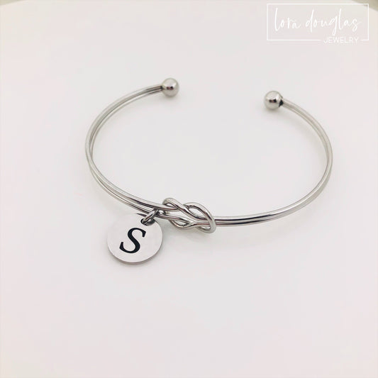 silver stainless steel knot bracelet with initial charm. bridesmaid gift
