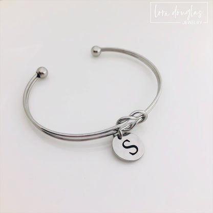 silver stainless steel knot bracelet with initial charm. bridesmaid gift
