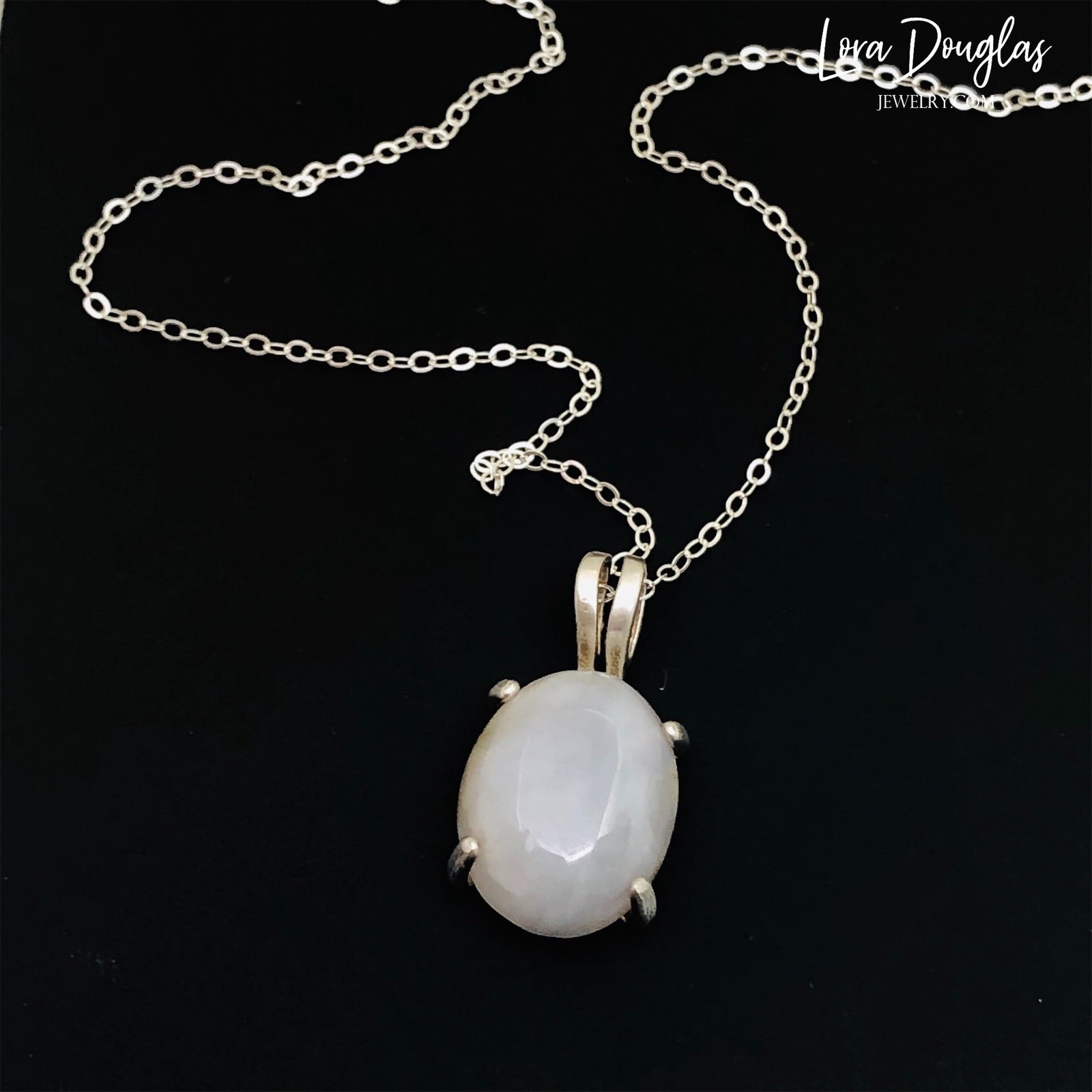 White Quartz Sterling Silver Pendant Necklace features a polished opaque white quartz, also known as quartzite, set in finely crafted sterling silver