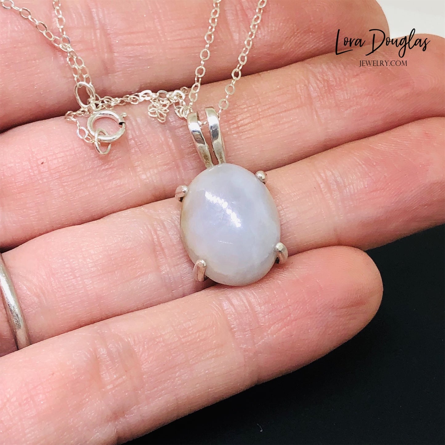 White Quartz Sterling Silver Pendant Necklace features a polished opaque white quartz, also known as quartzite, set in finely crafted sterling silver