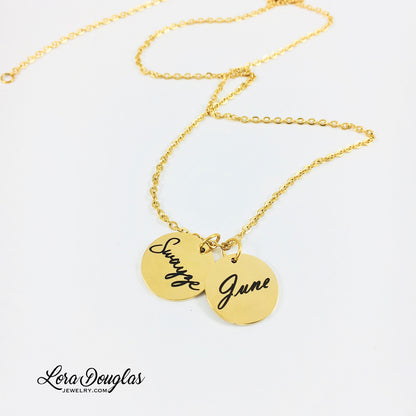 gold disc necklace with two round discs engraved with names