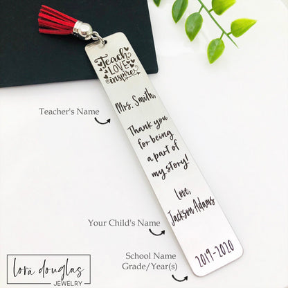 A stainless steel bookmarks with the phrases 'Teach Love Inspire' and 'Thank you for being my teacher' engraved on them, presented in a navy blue velvet pouch with tassels.
