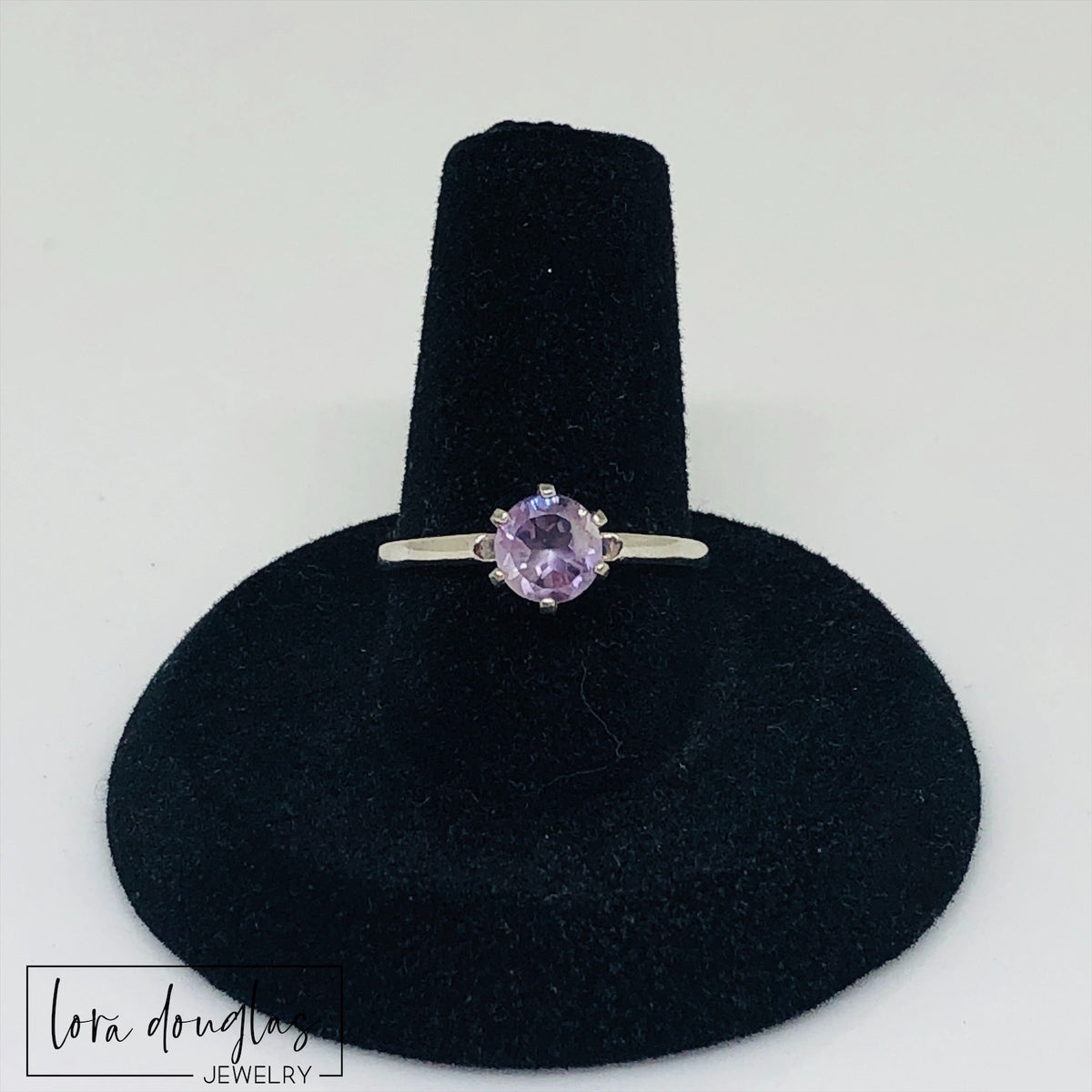 Pink amethyst solitaire ring featuring a petite 6mm gemstone set in genuine sterling silver, with soft lilac and lavender pink coloring and a finished size 6.5 band for natural gemstone jewelry lovers.
