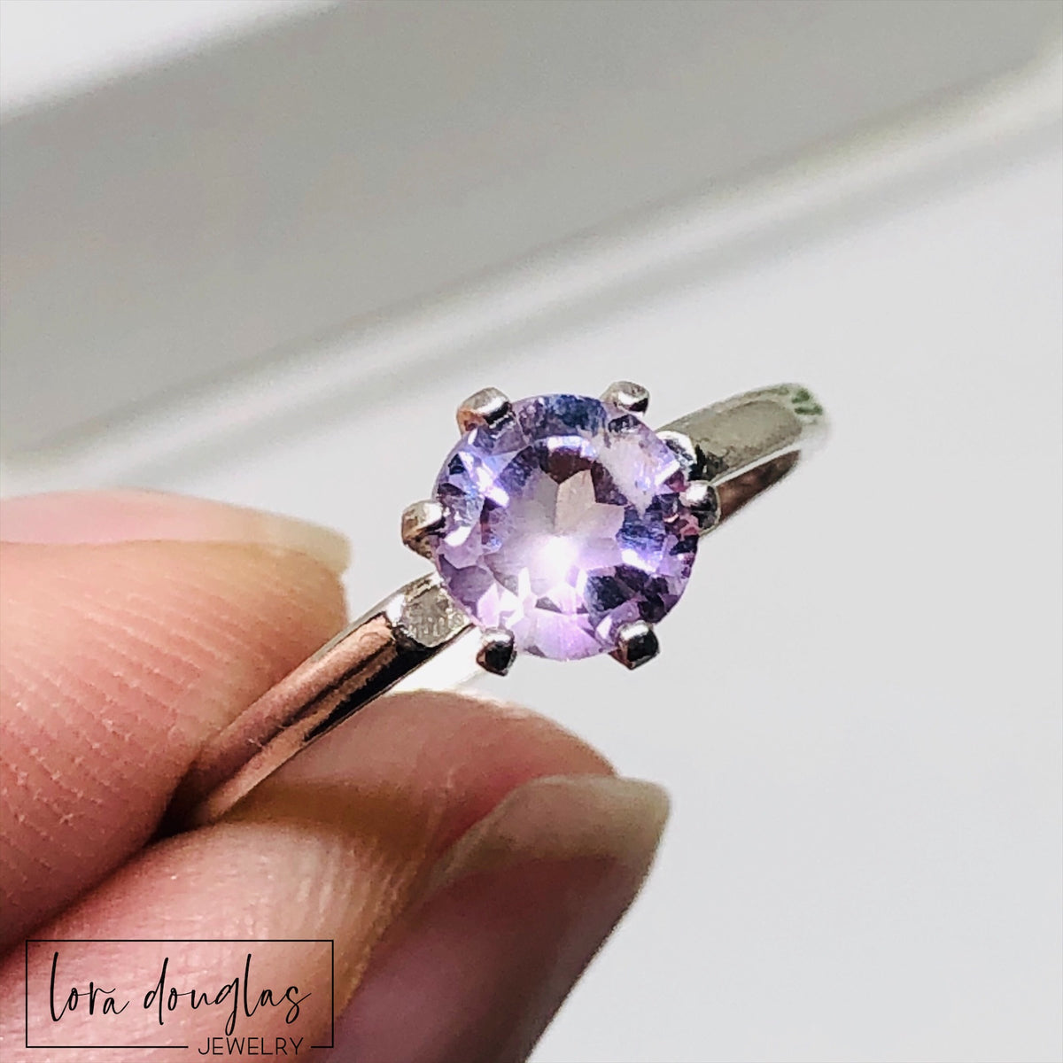 Pink gemstone ring featuring a 6mm pink amethyst stone in a classic sterling silver solitaire setting, shown in US size 6.5 for shoppers looking for February birthstone jewelry or a meaningful gift for her.
