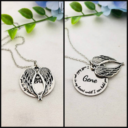 Two stainless steel memorial necklaces with swing lockets. One has a silver finish and the other has a gold tone. Angel wing charm necklace.