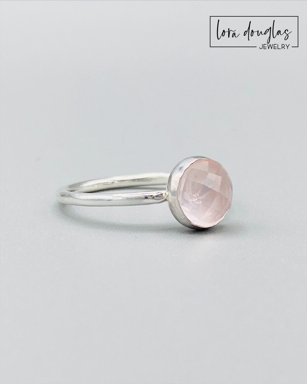 Rose cut rose quartz solitaire ring shown with its natural 8mm faceted pink gemstone and sterling silver setting, a finished US size 7.5 ring traditionally associated with love and suited for meaningful gifting.