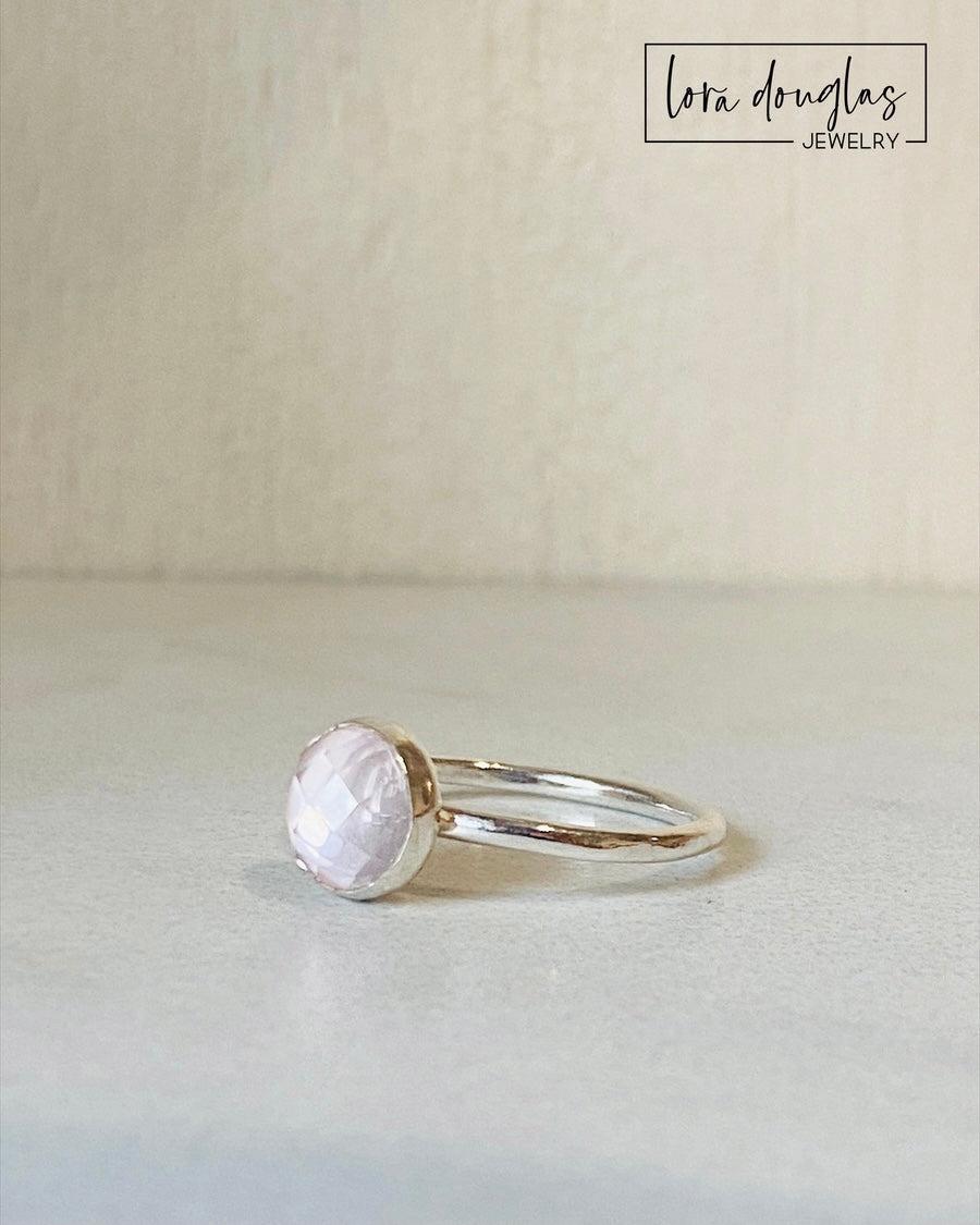 Rose quartz Love Stone ring featuring a natural 8mm faceted pink gemstone in a sterling silver solitaire setting, a finished US size 7.5 ring for an anniversary, Valentine's Day or meaningful jewelry gift.
