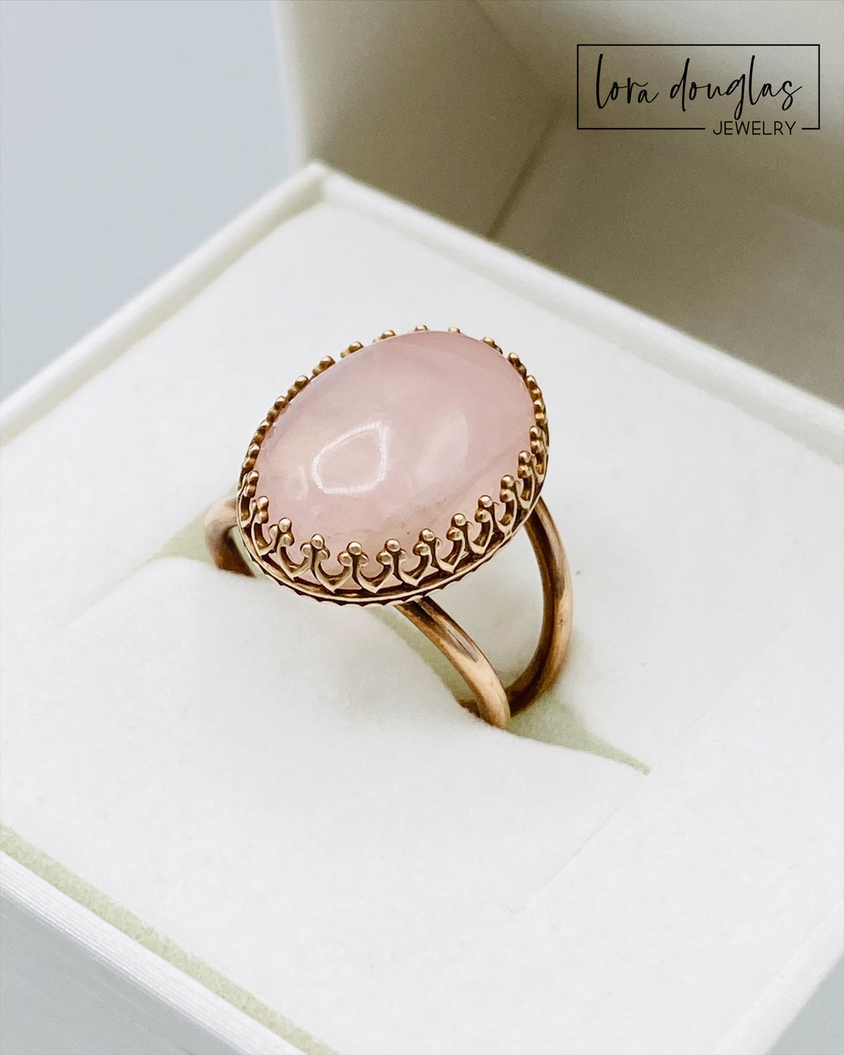 Rose quartz and bronze ring featuring a natural 18mm x 13mm pink gemstone, with the substantial stone as the focal point of this finished size 6 ring for lovers of distinctive gemstone jewelry.
