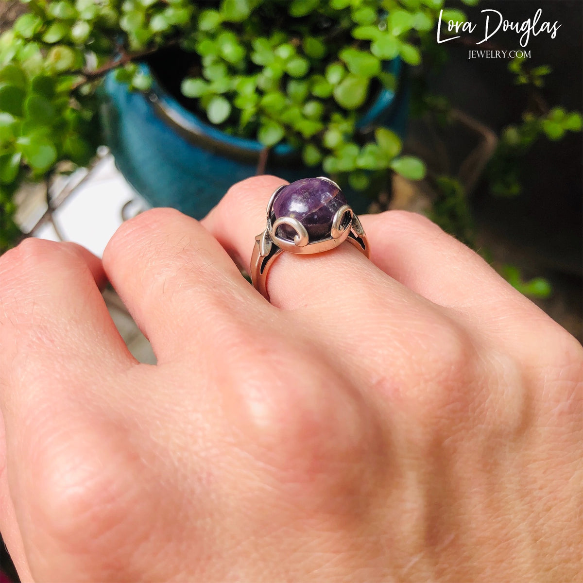 Sterling silver gemstone ring featuring a natural Purple India Ruby measuring 12mm, with the rich purple stone as the focal point of this finished US size 7 ring for natural stone and ruby jewelry collectors.

