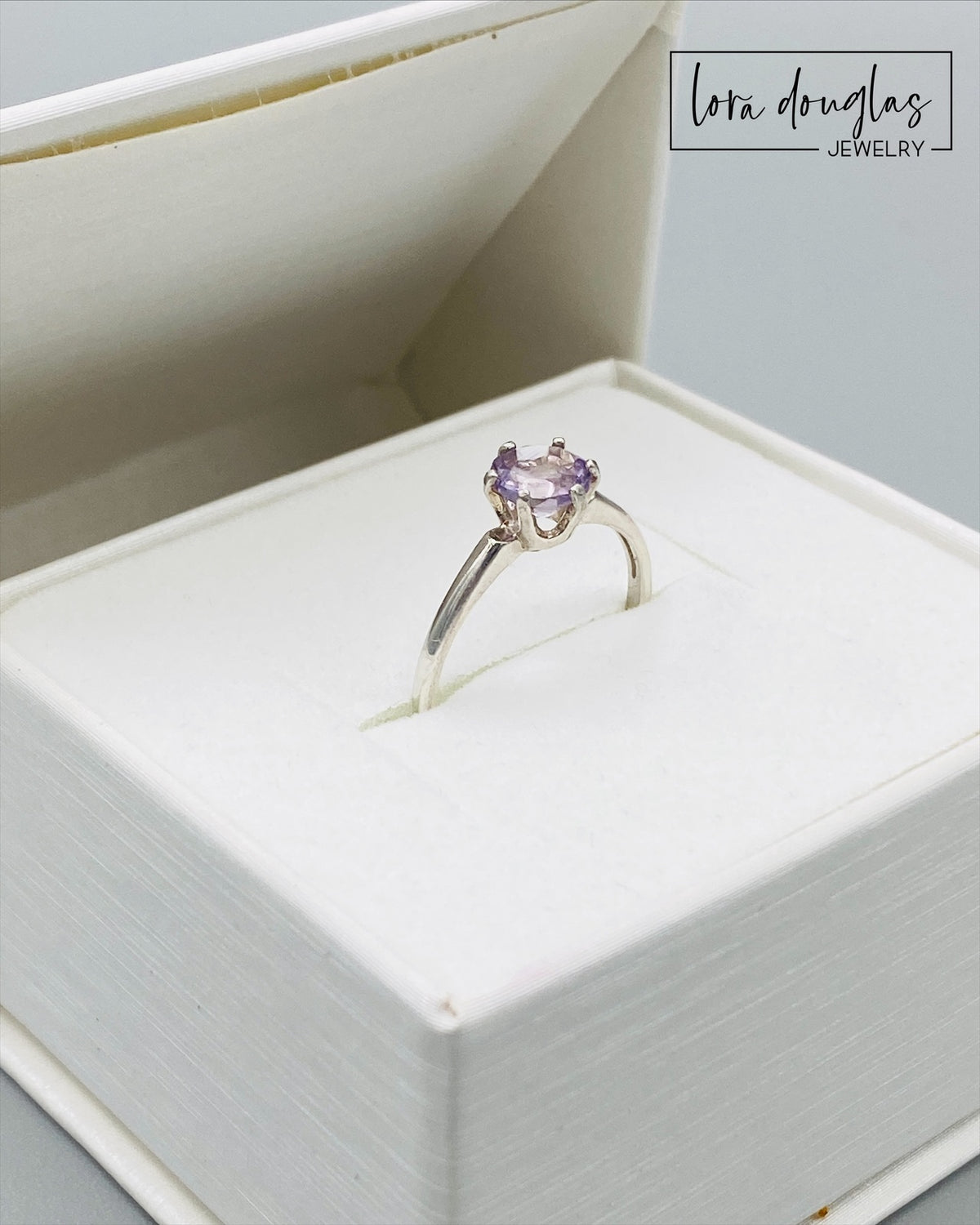 Sterling silver gemstone ring featuring a petite 6mm pink amethyst in a classic solitaire design, shown in US size 6.5 for shoppers searching for lavender jewelry, pink gemstones or an amethyst gift.
