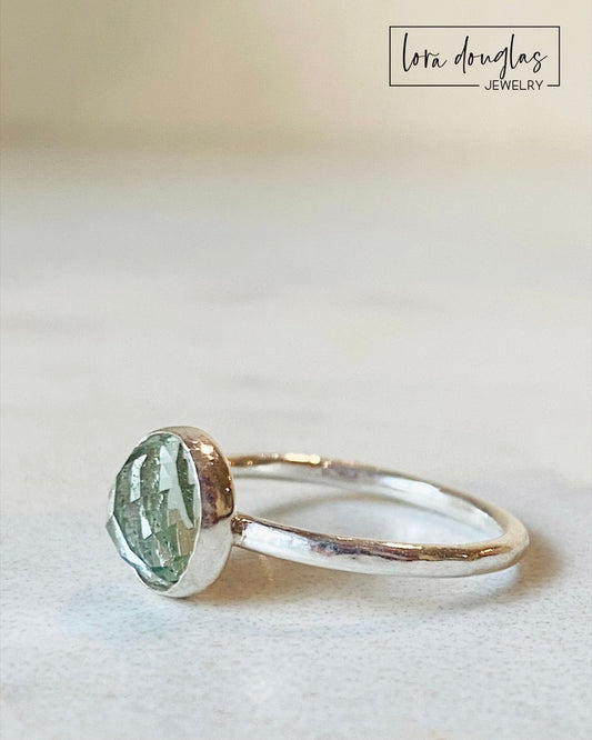 Sterling silver prasiolite ring featuring a softly colored 8mm green amethyst gemstone with a faceted rose cut, shown in finished US size 6 for lovers of green quartz and natural gemstone jewelry.
