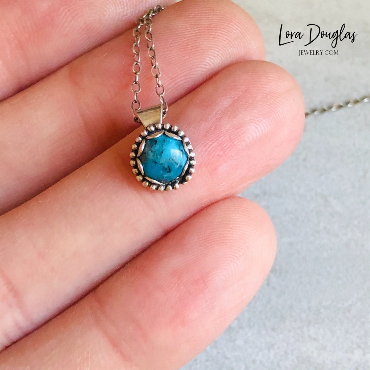 Turquoise birthstone necklace featuring a natural 5mm stone in a compact sterling silver pendant, paired with an 18 inch antique patina chain for shoppers seeking December birthday jewelry or a gift for her.

