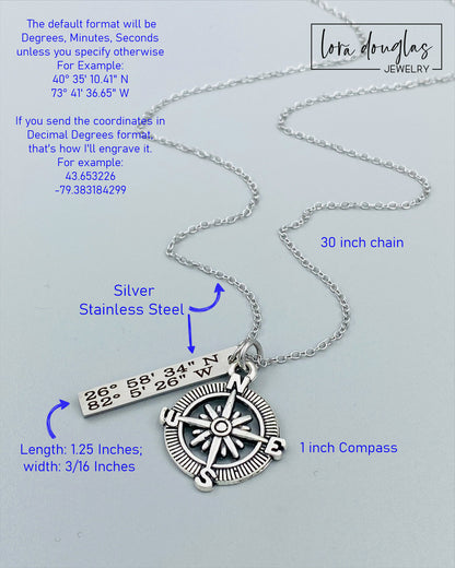 A silver compass necklace with a stainless steel pendant with personalized latitude and longitude coordinates