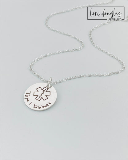 custom engraved medical ID pendant necklace shown in silver stainless steel with engraved medical alert symbol and personalized health information, durable hypoallergenic medical alert necklace with minimalist style