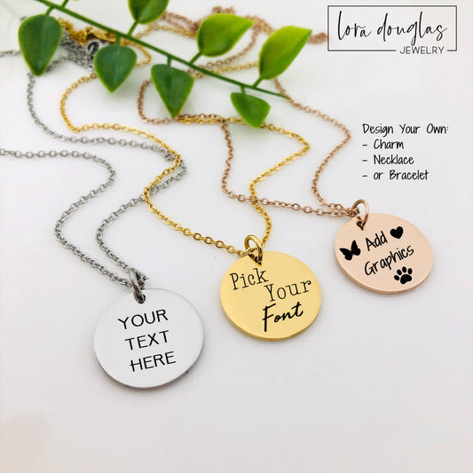 Three engraved pendant necklaces with chain add-ons, featuring custom text on each pendant. One in silver, one in gold, and one in rose gold, displayed on a white surface with a green plant in the background.