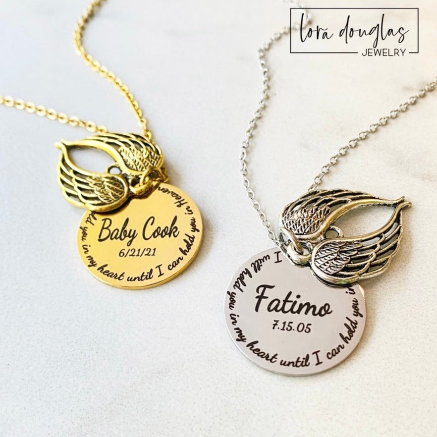 Two stainless steel memorial necklaces with swing lockets. One has a silver finish and the other has a gold tone. Angel wing charm necklace.